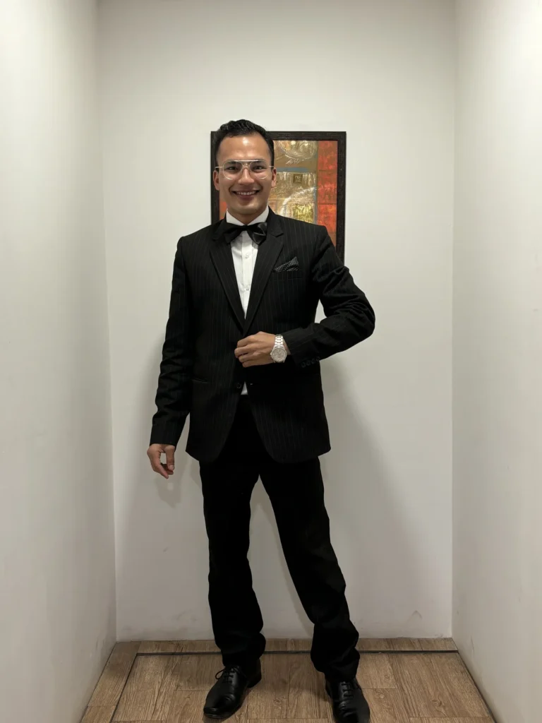 Hospitality professional wearing a formal suit and bow tie