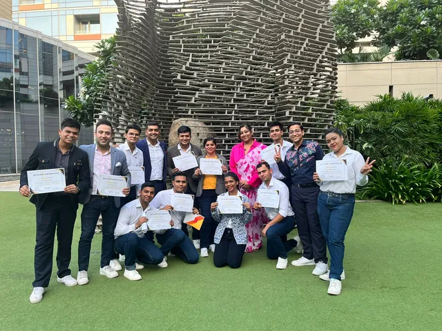 Elite Butlers training participants holding their butler certificates